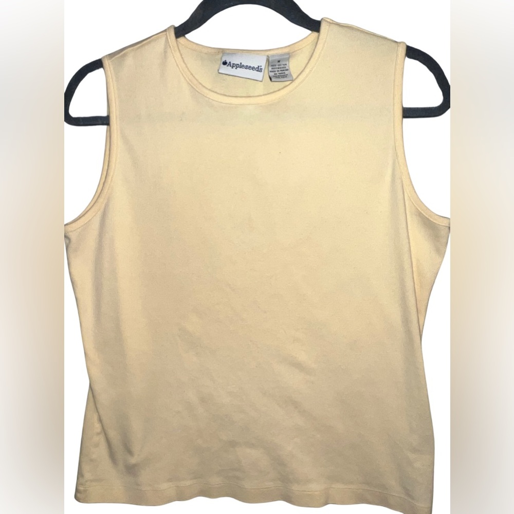 Size Woman’s medium Appleseed’s sleeveless yellow top.